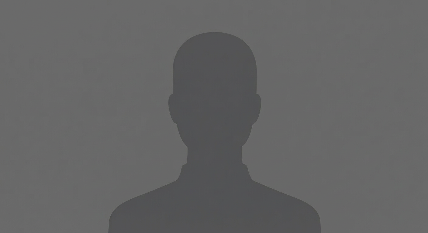 Middle-aged woman with grey hair smiling joyfully in a bright artist's studio.